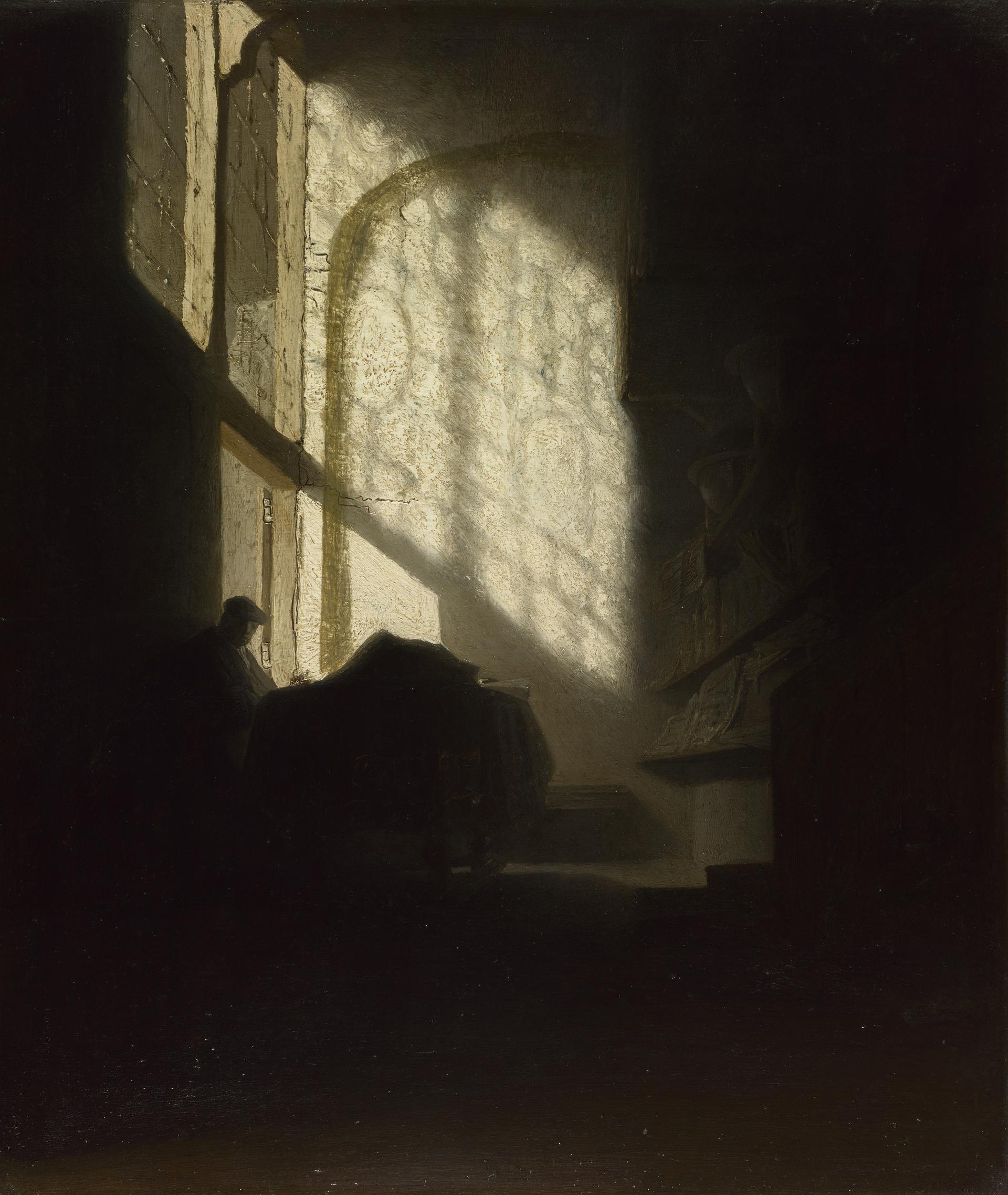 A Man seated reading at a Table in a Lofty Room by Rembrandt