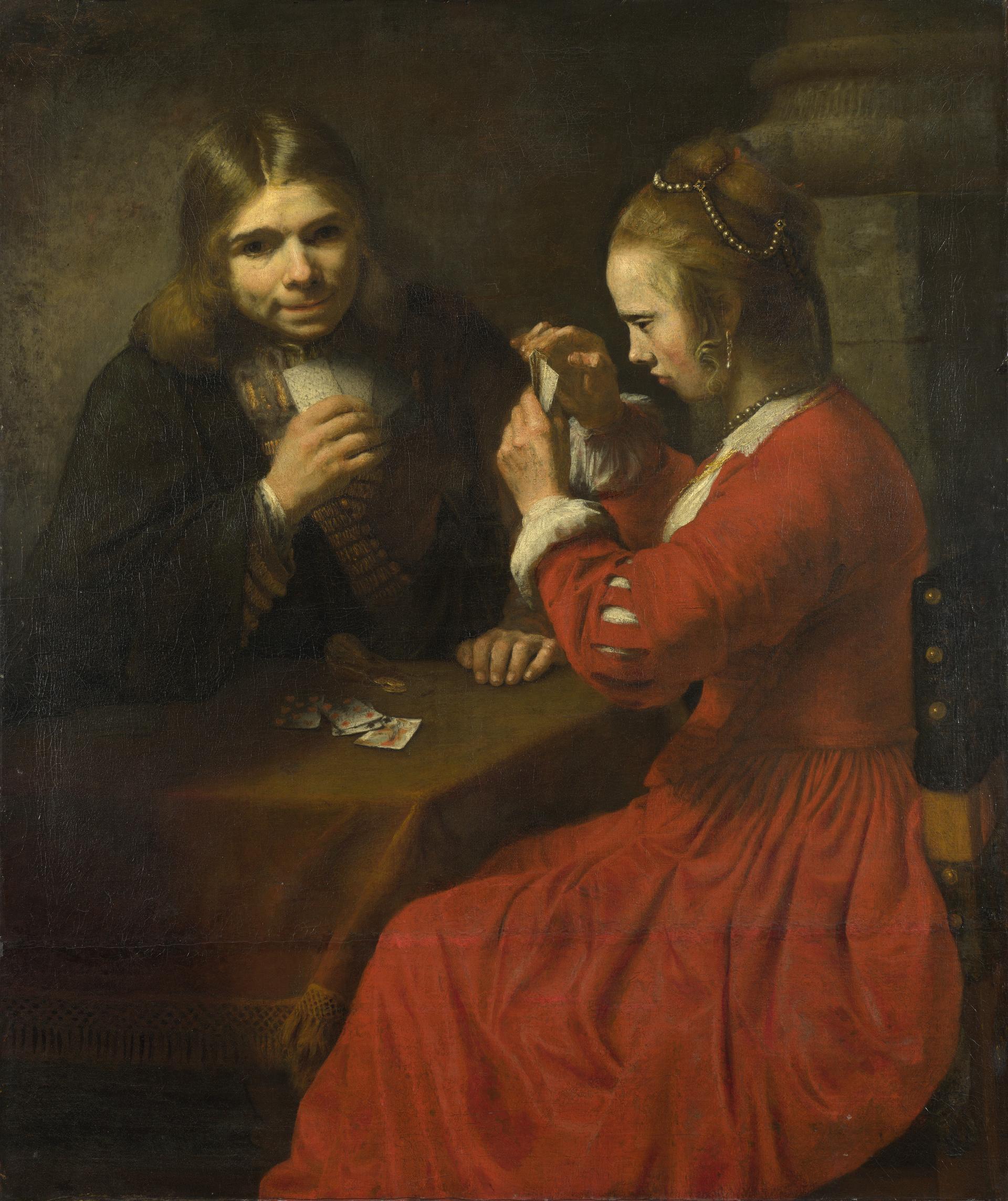 A Young Man and a Girl playing Cards by Rembrandt
